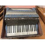 A cased Coronado accordion