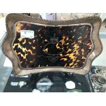 A silver and tortoiseshell dressing table tray,
