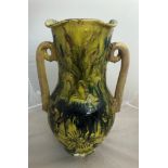 A large 19th century ceramic vase with floral and animal decoration