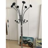 A chrome hatstand