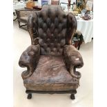 A 19th century leather buttonback upholstered reading/library chair