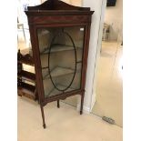 An Edwardian mahogany inlaid corner display cabinet with silk fitted interior