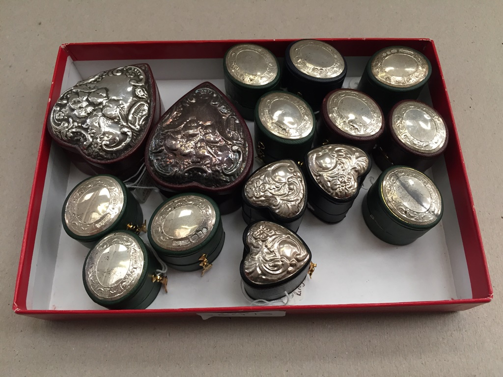 A collection of silver-topped and leather ring boxes;