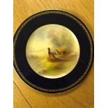 A Royal Worcester cabinet plate, painted by Stinton, depicting pheasants on a blue ground: W 15.