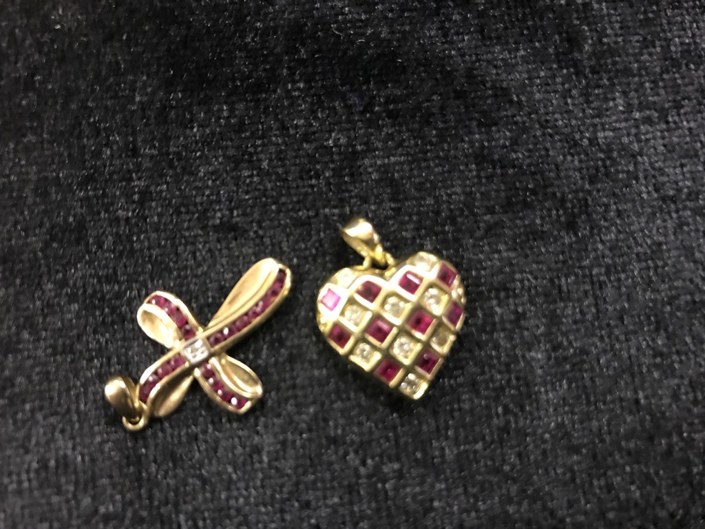 A 9ct gold cross set rubies;