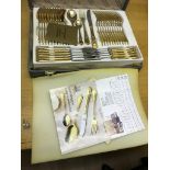 A cased gold Solingen cutlery set in flight case