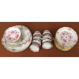 A Meissen teaset and side plates in an elegant floral design