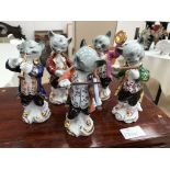 Five ceramic cat band figures