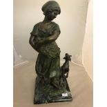 A 19th century bronze of a peasant girl and goat on a stepped marble base,