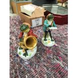 Two ceramic frog musicians