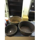 Three cast-iron metal bowls