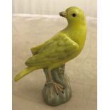 A 19th/20th C Meissen yellow song bird figurine (chip to one of the wings)