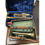 Cased trumpets to include a vintage example