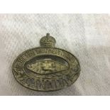 A Canada cap badge,