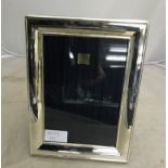 A large HM silver photograph frame