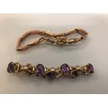 Two ladies' 9ct gold articulated charm bracelets