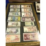 A set of 14 framed banknotes from various countries Brazil, Ghana, Indonesia,