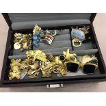 A jewellery box containing dress jewellery, rings,