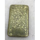 A 19th century card case: brass with incised foliate decoration