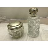 A HM silver-topped hair tidy and stoppered bottle