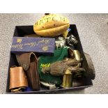 A box of odds to inc a mini rugby ball, canon shells, a Mercedes mascot,