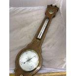 A mahogany inlaid barometer and thermometer