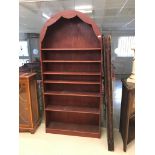 An arch-topped bookcase