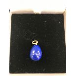 A Lapis Lazuli egg pendant set with old cut diamond marked 'Karl Faberge'