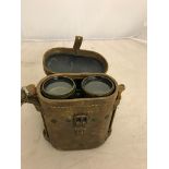 A cased pair of military binoculars