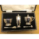 A cased hallmarked silver condiment set