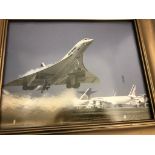 A framed photograph of an AirFrance Concord taking off,