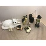 A quantity of ceramic cat figures