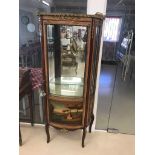 A French Kingwood vitrine with brass mounts and fittings
