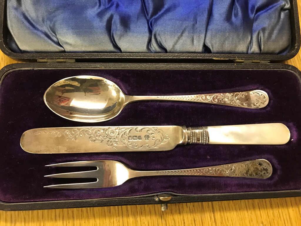 A cased hallmarked silver knife,