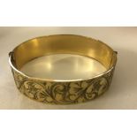 WITHDRAWN A 9ct gold engraved bangle