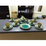 A gilt and green china tea set;