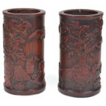 Two Chinese stained bamboo brushpots 18th/19th century Carved in relief with a vase of peonies