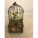 A metal birdcage decorated with classical paintings