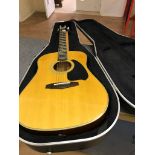 A cased Ibanez model PF35 six-string acoustic guitar and accessories,