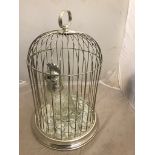 A silver-plated bird cage;