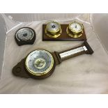 Three aneroid barometers to inc a bulkhead type with clock