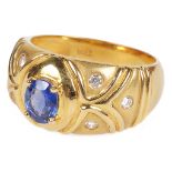 An 18ct Ceylon Sapphire 0.90ct Ring Set with Diamonds: Hallmarked 18ct,with central oval cut 0.