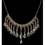 A 14k Pendaluque Cut Aquamarine and Cabochon Ruby Frill Necklace: Comprising 13 drops of