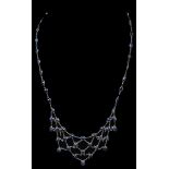 A 14ct White Gold Oval Cut Ceylon Sapphire Set Necklace: Delicately wired sapphire necklace,