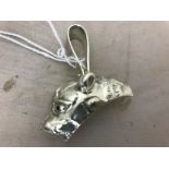 A large silver panther pendant set with rubies