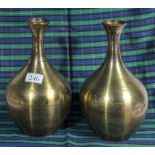 A pair of brass vases