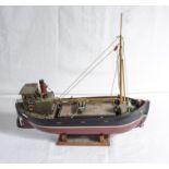 A model boat on stand