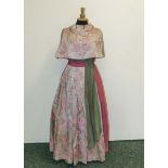 A bridesmaid dress, pink floral with green sash and bolero