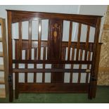 An Edwardian bed headboard and footboard