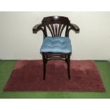 A captain style chair together with a rug